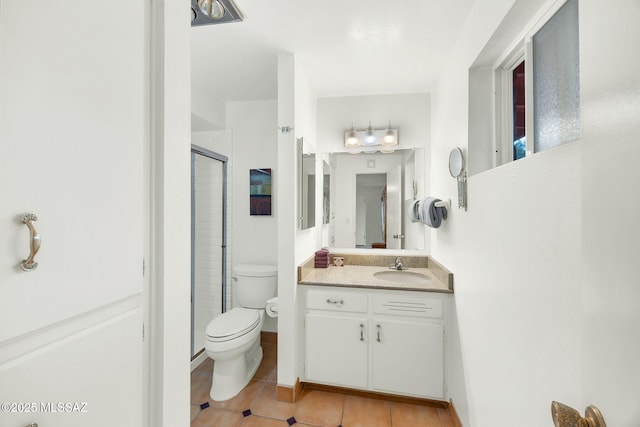4921 E Camino De Los Olivos, Tucson, AZ 85718 - bathroom featuring tile patterned floors, toilet, a stall shower, and vanity