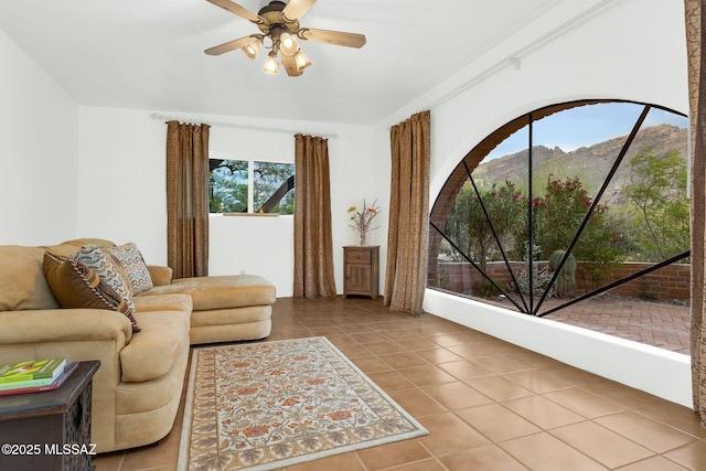 4921 E Camino De Los Olivos, Tucson, AZ 85718 - tiled living area with a mountain view and ceiling fan