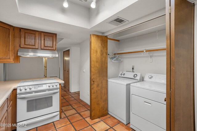9350 E Speedway Blvd Unit 6, Tucson, AZ 85710 - laundry room with independent washer and dryer and light tile patterned flooring