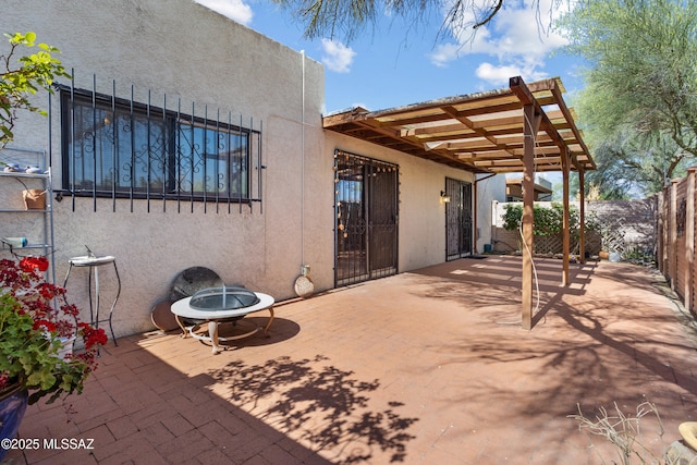 9350 E Speedway Blvd Unit 6, Tucson, AZ 85710 - view of patio / terrace with a pergola and a fire pit