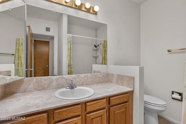 9350 E Speedway Blvd Unit 6, Tucson, AZ 85710 - bathroom with toilet, vanity, a shower with shower curtain, and tile patterned flooring