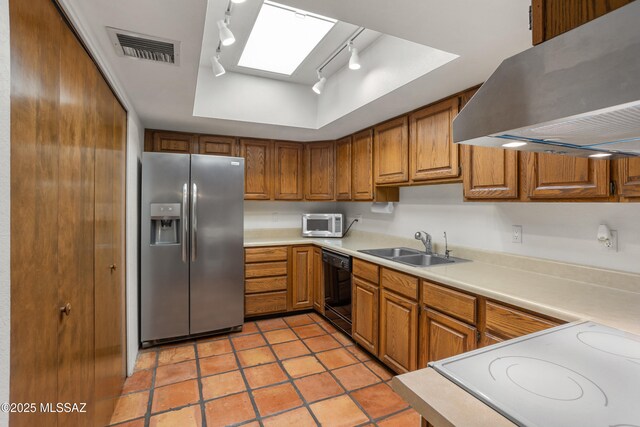 9350 E Speedway Blvd Unit 6, Tucson, AZ 85710 - kitchen with stainless steel fridge, exhaust hood, track lighting, a sink, and brown cabinets
