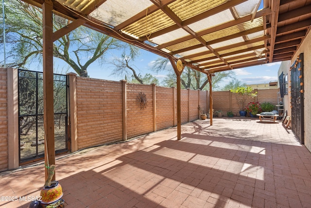 9350 E Speedway Blvd Unit 6, Tucson, AZ 85710 - fenced backyard with a pergola and a patio area