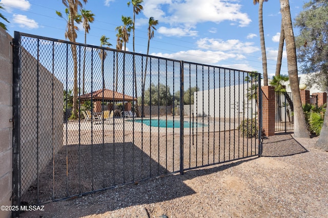 9350 E Speedway Blvd Unit 6, Tucson, AZ 85710 - gate with a community pool and a gazebo