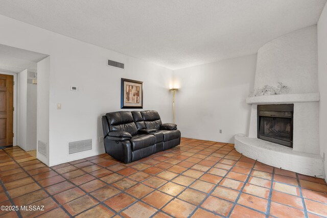 9350 E Speedway Blvd Unit 6, Tucson, AZ 85710 - living area featuring a large fireplace