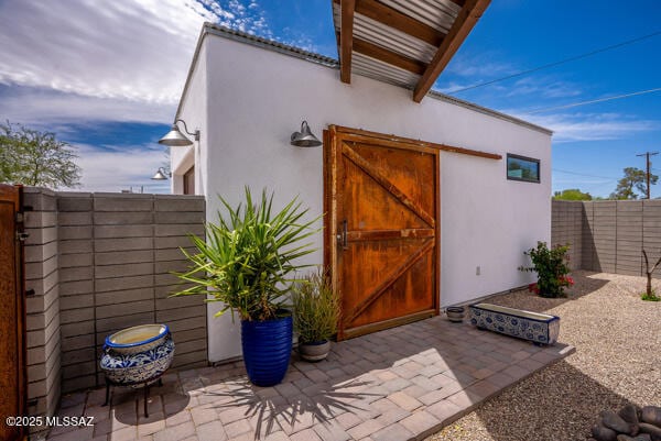 view of outdoor structure with fence