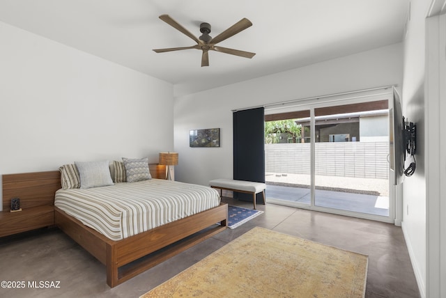 bedroom with access to outside, concrete flooring, and ceiling fan