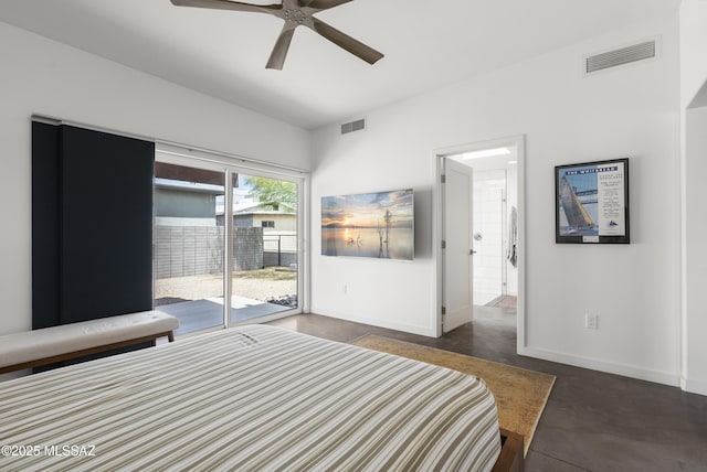 bedroom featuring access to exterior, finished concrete flooring, baseboards, and a ceiling fan
