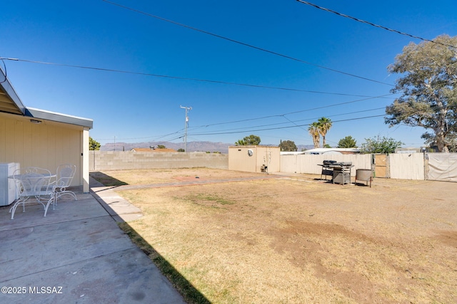 615 W 6th Ave, San Manuel, AZ 85631 - fenced backyard with a patio area