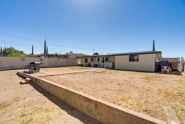 615 W 6th Ave, San Manuel, AZ 85631 - back of property featuring a fenced backyard and a patio area