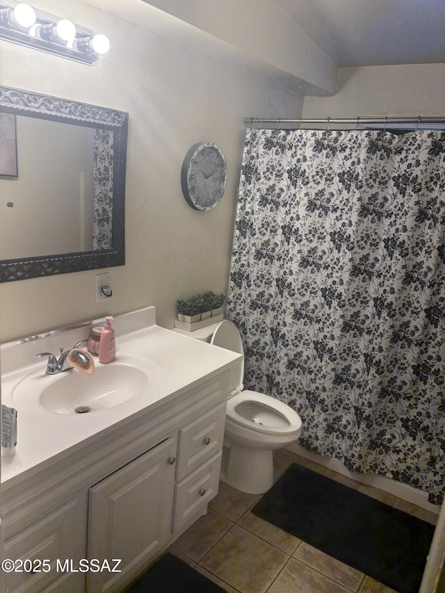 4416 N Pomona Ave, Tucson, AZ 85705 - bathroom with vanity, tile patterned flooring, toilet, and a shower with shower curtain