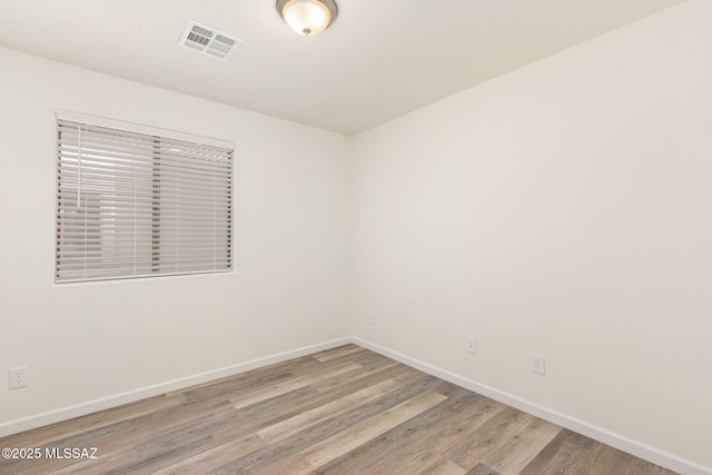 12356 N Globe Mallow Pl, Marana, AZ 85658 - spare room with baseboards and light wood-type flooring