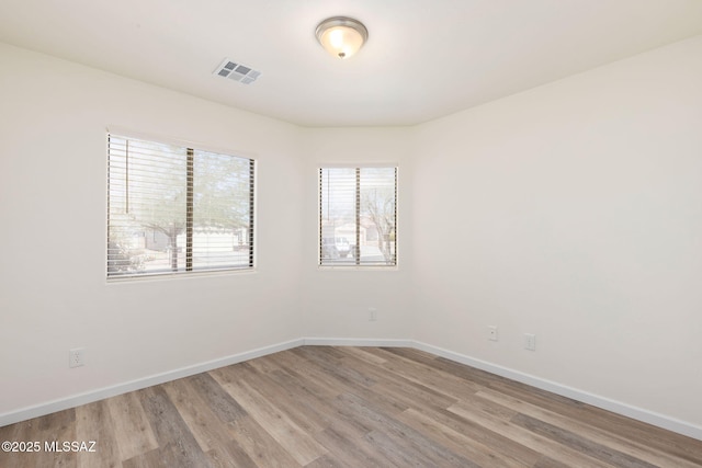 12356 N Globe Mallow Pl, Marana, AZ 85658 - empty room featuring light wood-type flooring and baseboards