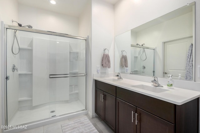 6633 E Paseo De Sambuca, Tucson, AZ 85756 - full bathroom featuring a stall shower, tile patterned floors, double vanity, and recessed lighting