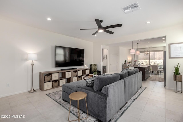 6633 E Paseo De Sambuca, Tucson, AZ 85756 - living area with a ceiling fan, recessed lighting, baseboards, and light tile patterned floors