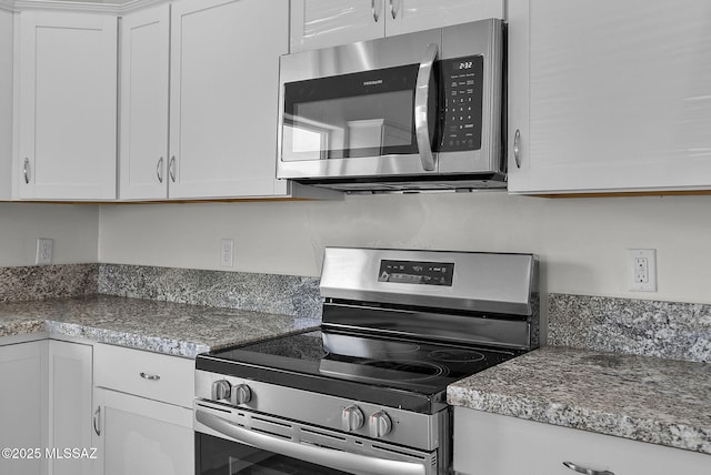 1895 Roma Ct, Rio Rico, AZ 85648 - kitchen featuring appliances with stainless steel finishes and white cabinetry