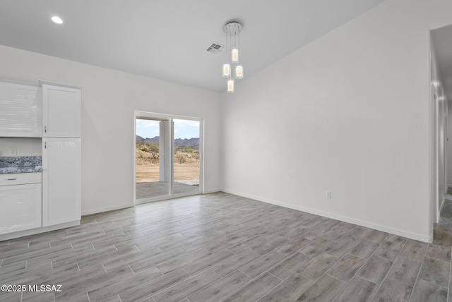 1895 Roma Ct, Rio Rico, AZ 85648 - unfurnished dining area with light wood-style floors, baseboards, and recessed lighting