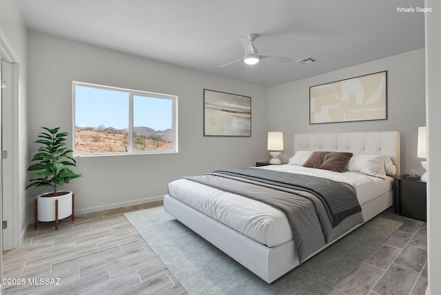 1895 Roma Ct, Rio Rico, AZ 85648 - bedroom with wood finish floors, baseboards, and a ceiling fan