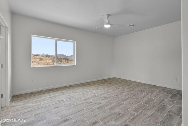 1895 Roma Ct, Rio Rico, AZ 85648 - empty room featuring a ceiling fan, light wood-style floors, and baseboards