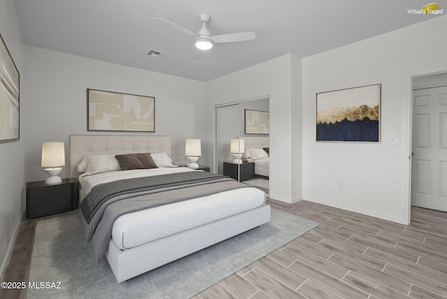 1895 Roma Ct, Rio Rico, AZ 85648 - bedroom with wood finished floors, baseboards, and a ceiling fan