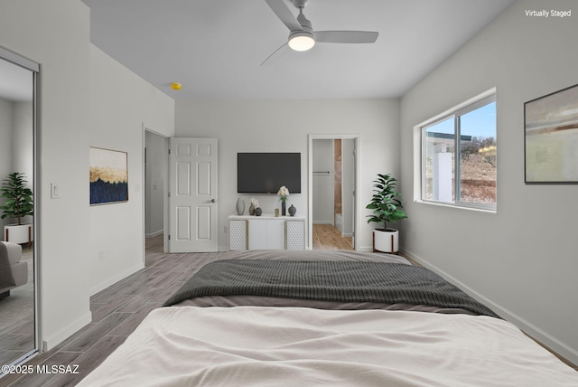 1895 Roma Ct, Rio Rico, AZ 85648 - bedroom featuring baseboards, wood finished floors, and a ceiling fan