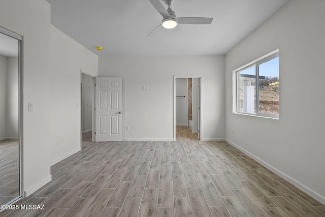 1895 Roma Ct, Rio Rico, AZ 85648 - unfurnished bedroom with wood finished floors, baseboards, ceiling fan, and a closet