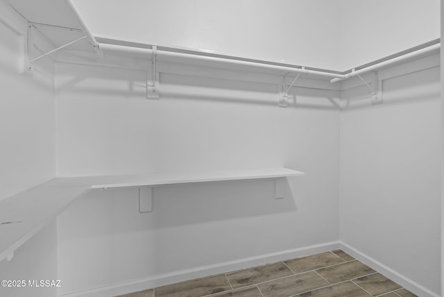 1895 Roma Ct, Rio Rico, AZ 85648 - walk in closet featuring wood finished floors