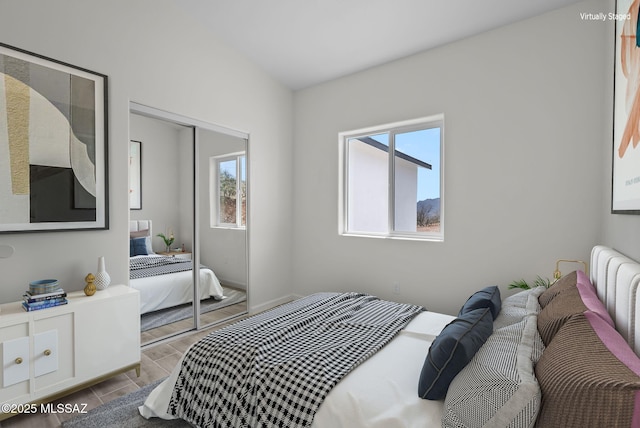 1895 Roma Ct, Rio Rico, AZ 85648 - bedroom featuring multiple windows, a closet, and baseboards