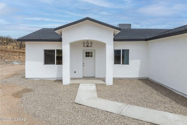1895 Roma Ct, Rio Rico, AZ 85648 - entrance to property with roof with shingles and stucco siding