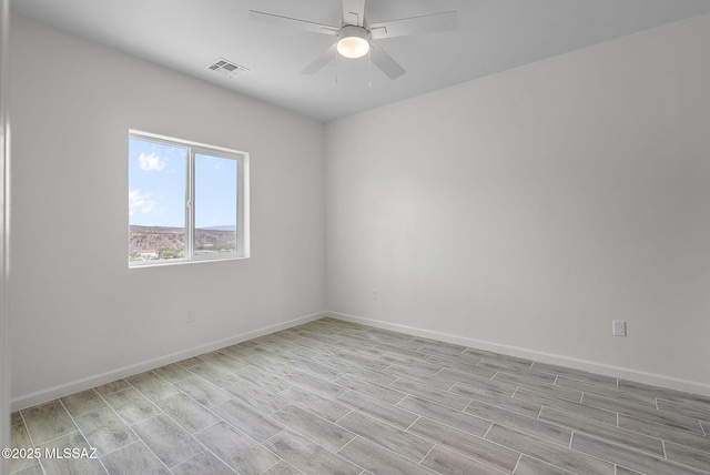1895 Roma Ct, Rio Rico, AZ 85648 - empty room featuring a ceiling fan, light wood-type flooring, and baseboards