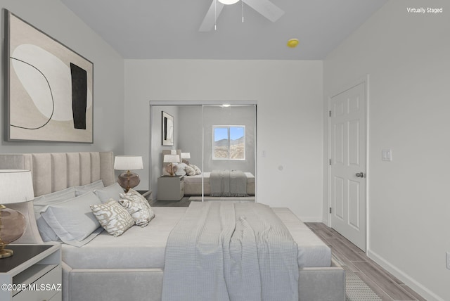 1895 Roma Ct, Rio Rico, AZ 85648 - bedroom with wood finished floors, a closet, a ceiling fan, and baseboards