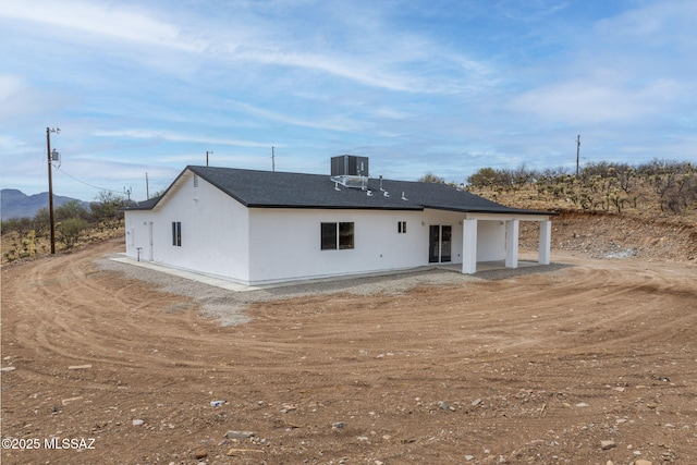 1895 Roma Ct, Rio Rico, AZ 85648 - rear view of property featuring stucco siding and cooling unit