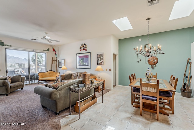 4043 S Golden Lynx Rd, Green Valley, AZ 85614 - living area featuring a skylight, a chandelier, light tile patterned flooring, and a ceiling fan