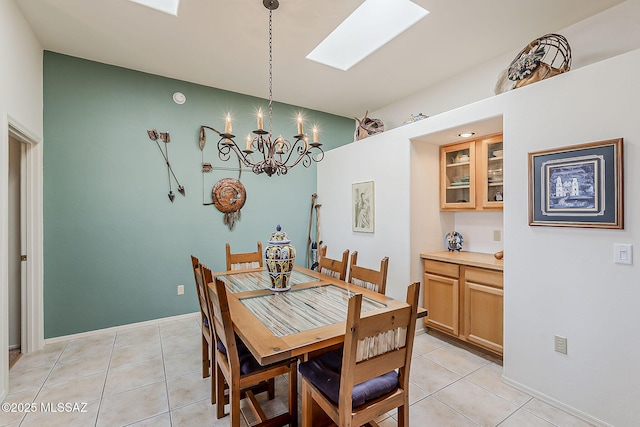 4043 S Golden Lynx Rd, Green Valley, AZ 85614 - dining space with a skylight, a chandelier, and light tile patterned floors