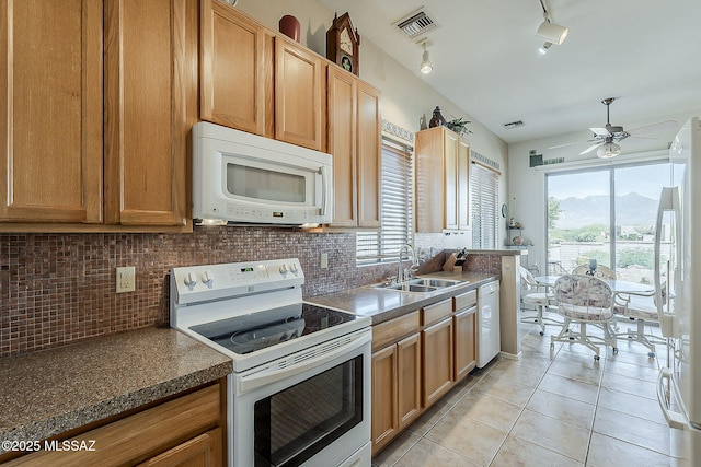 4043 S Golden Lynx Rd, Green Valley, AZ 85614 - kitchen with white appliances, a sink, a ceiling fan, decorative backsplash, and light tile patterned floors