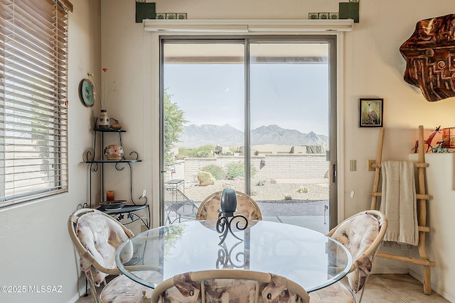 4043 S Golden Lynx Rd, Green Valley, AZ 85614 - dining room with a mountain view, plenty of natural light, and baseboards