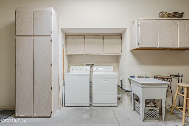 4043 S Golden Lynx Rd, Green Valley, AZ 85614 - clothes washing area featuring cabinet space, separate washer and dryer, and baseboards