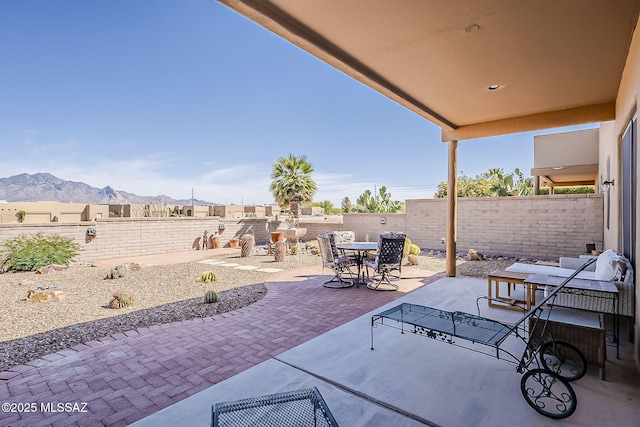 4043 S Golden Lynx Rd, Green Valley, AZ 85614 - view of patio with outdoor dining area, a mountain view, and a fenced backyard