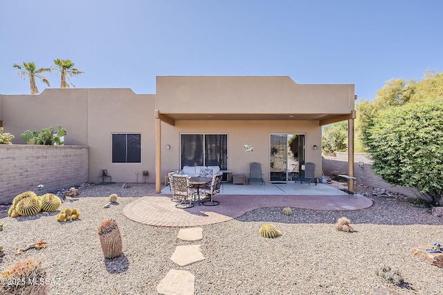 4043 S Golden Lynx Rd, Green Valley, AZ 85614 - rear view of property featuring stucco siding, a patio, and fence