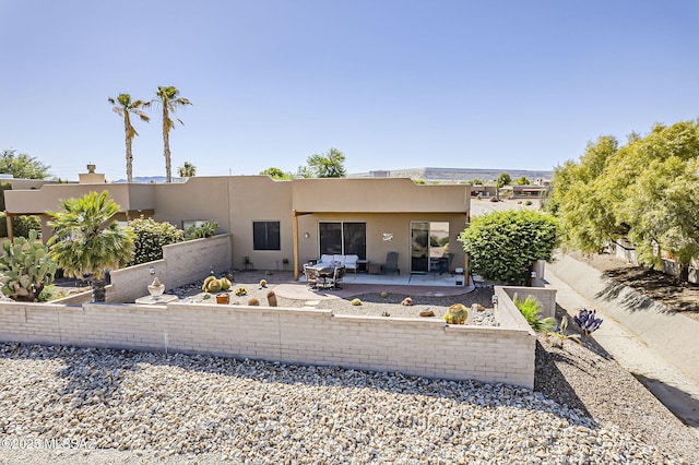 4043 S Golden Lynx Rd, Green Valley, AZ 85614 - rear view of house with stucco siding, a patio area, and fence