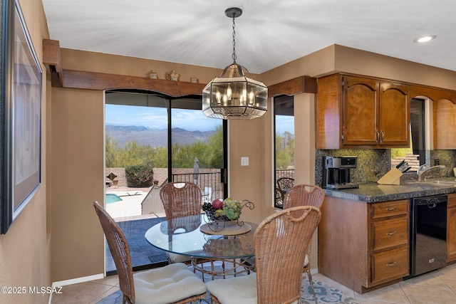 571 N Tanque Verde Loop Rd, Tucson, AZ 85748 - dining room featuring a chandelier, light tile patterned floors, and a mountain view