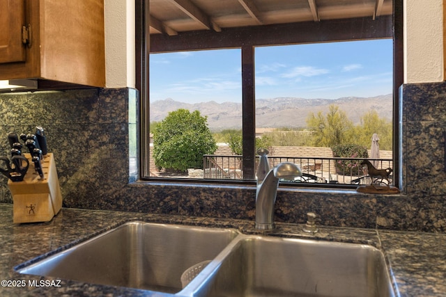 571 N Tanque Verde Loop Rd, Tucson, AZ 85748 - kitchen view of mountains, backsplash, and brown cabinetry