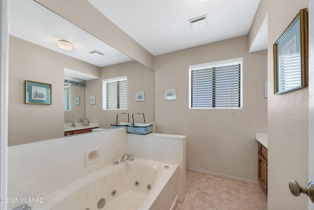 571 N Tanque Verde Loop Rd, Tucson, AZ 85748 - full bath featuring vanity, a jetted tub, and tile patterned flooring