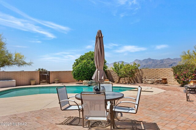 571 N Tanque Verde Loop Rd, Tucson, AZ 85748 - view of swimming pool with a mountain view, a fenced backyard, and a patio