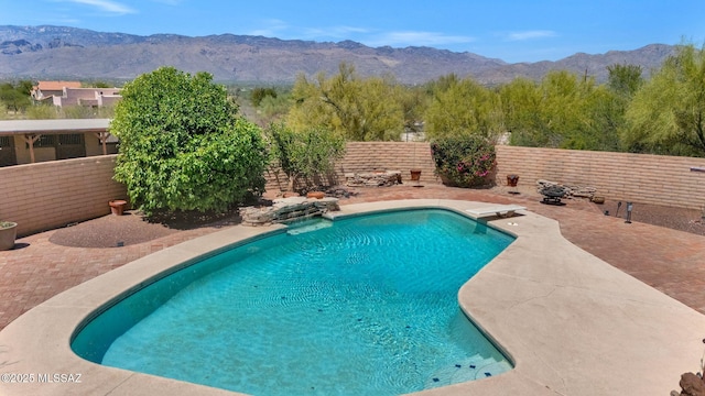 571 N Tanque Verde Loop Rd, Tucson, AZ 85748 - view of swimming pool with a mountain view, a fenced backyard, and a patio area
