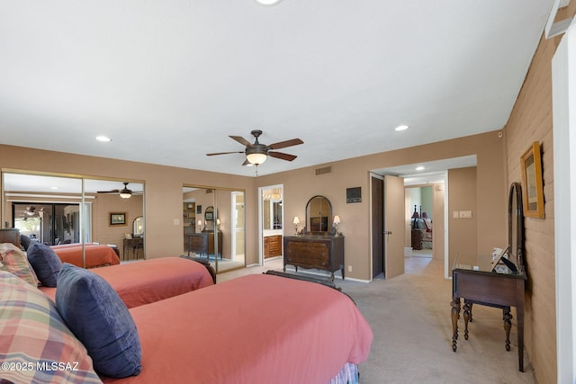 571 N Tanque Verde Loop Rd, Tucson, AZ 85748 - bedroom with multiple closets, light colored carpet, recessed lighting, a ceiling fan, and ensuite bath