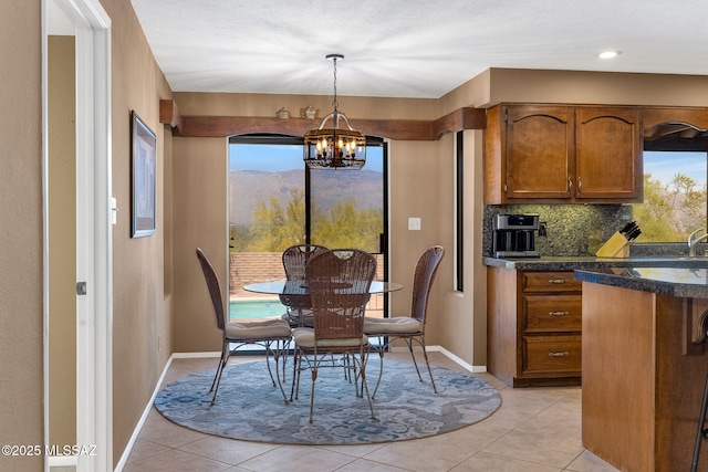 571 N Tanque Verde Loop Rd, Tucson, AZ 85748 - dining room featuring a chandelier and light tile patterned floors