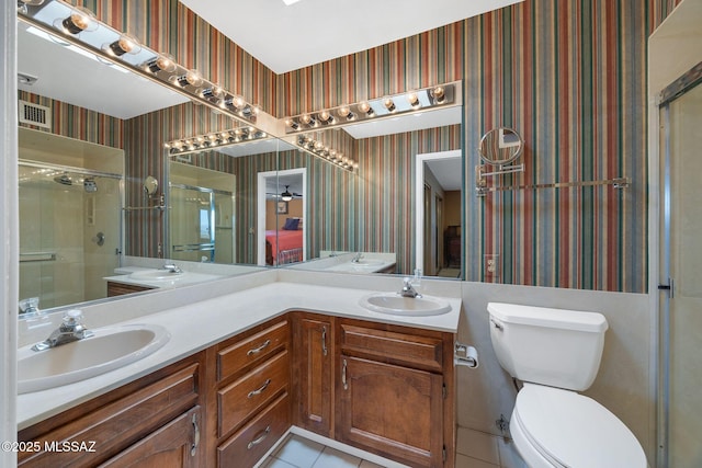 571 N Tanque Verde Loop Rd, Tucson, AZ 85748 - full bathroom featuring wallpapered walls, tile patterned flooring, a shower stall, and double vanity