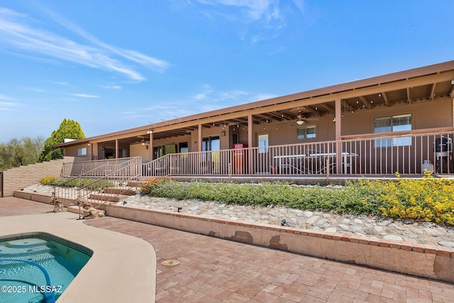 571 N Tanque Verde Loop Rd, Tucson, AZ 85748 - back of property featuring a ceiling fan and a patio area