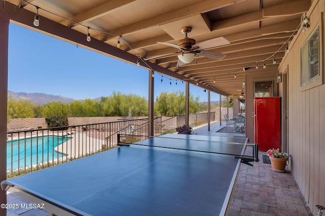 571 N Tanque Verde Loop Rd, Tucson, AZ 85748 - fenced backyard with a ceiling fan, a patio, and a mountain view